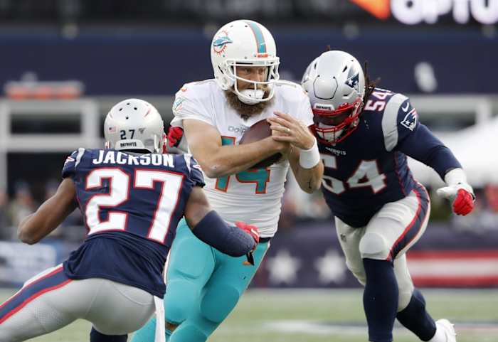 Miami quarterback Ryan Fitzpatrick (14) tries to cut between New England Patriots cornerback J.C. Jackson (27) and linebacker Dont'a Hightower. Mandatory Credit: Winslow Townson-USA TODAY